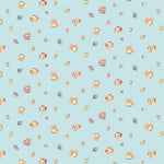 Light blue fabric with scattered colorful seashells in pink, yellow, and navy tones