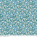 Riley Blake floral fabric with blue, white, and sage flowers on dark teal background
