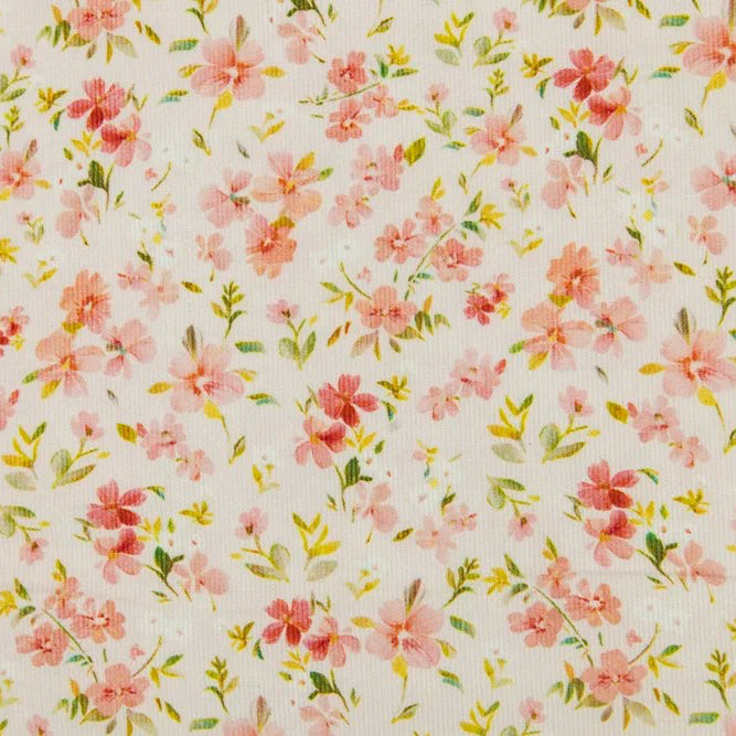 Pink floral corduroy fabric with small pink flowers and green leaves on cream background