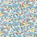 Blue poppy floral cotton poplin fabric with coral and yellow accent flowers on white background