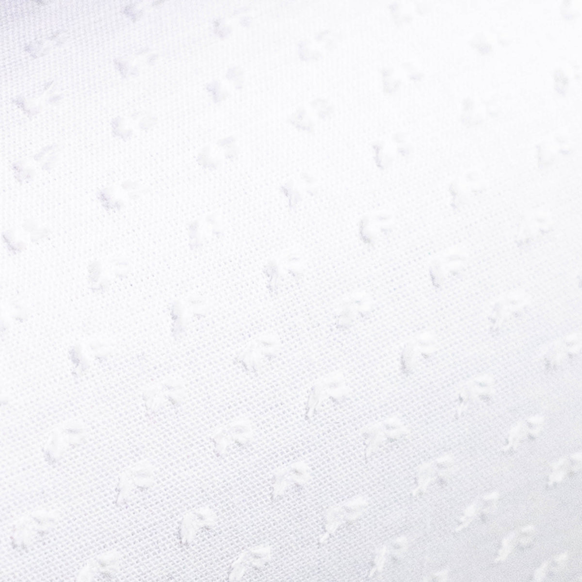 White poly dotted Swiss fabric with subtle woven dot texture pattern
