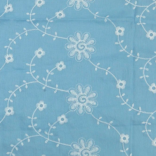 Sky blue cotton eyelet fabric with white embroidered daisy vine floral pattern