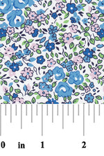 White cotton fabric with blue and pink floral print, small roses and leaves pattern