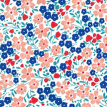 White cotton fabric with pink, blue, and red floral ditsy print pattern