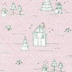 Pink cotton fabric with green winter scene print featuring houses, trees, and snowmen