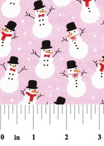 Pink cotton fabric with white snowmen wearing black top hats and red scarves