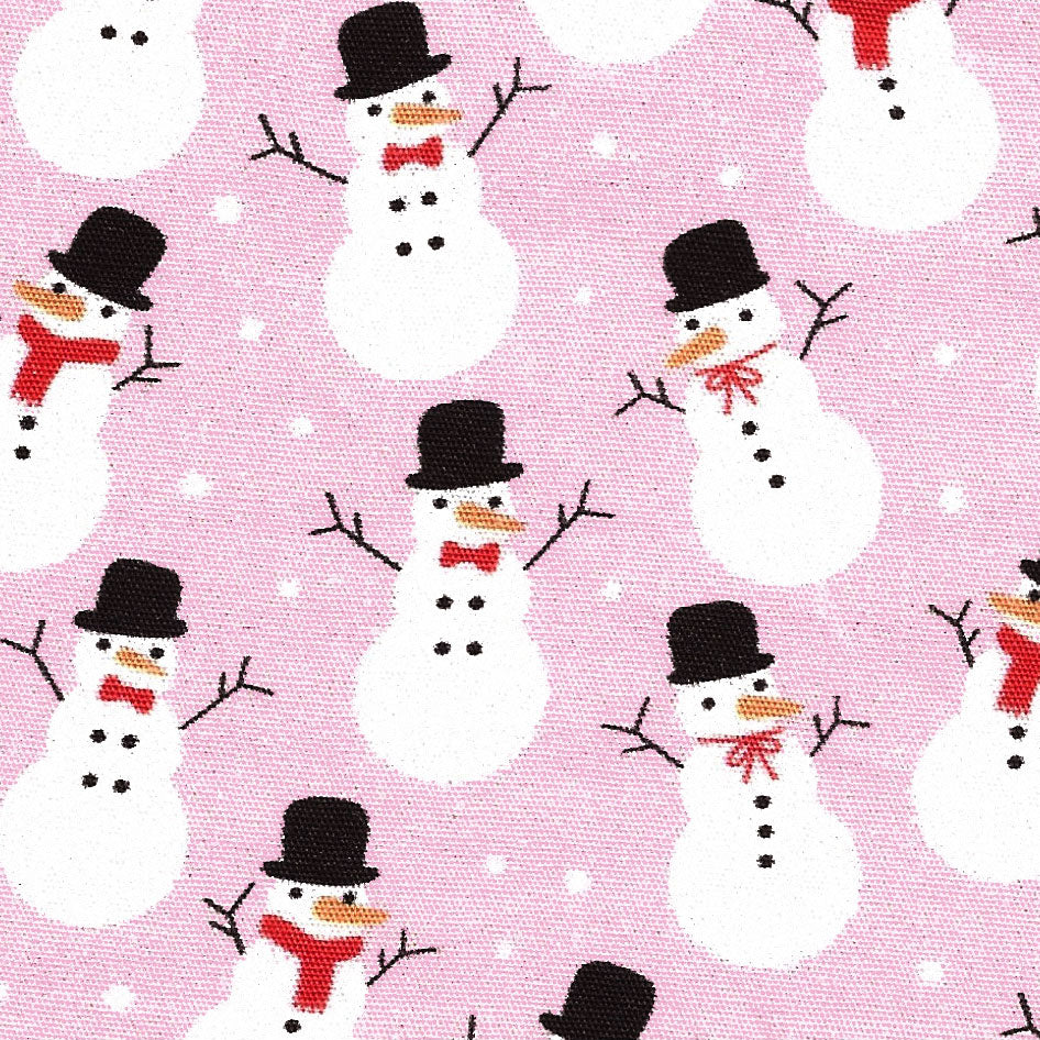 Pink cotton fabric printed with white snowmen wearing black top hats and red scarves