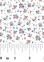 White cotton fabric with scattered pink floral bouquets and navy blue leaves pattern