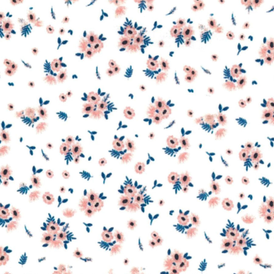 White fabric with scattered pink floral bouquets and navy blue leaves pattern