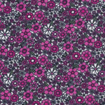 Pink and white floral cotton fabric with small ditsy flowers and green leaves