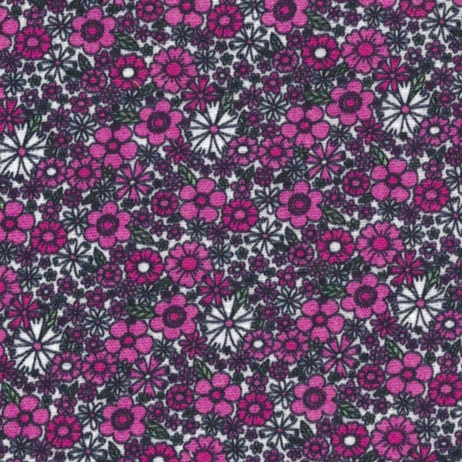 Pink and white floral cotton fabric with small ditsy flowers and green leaves