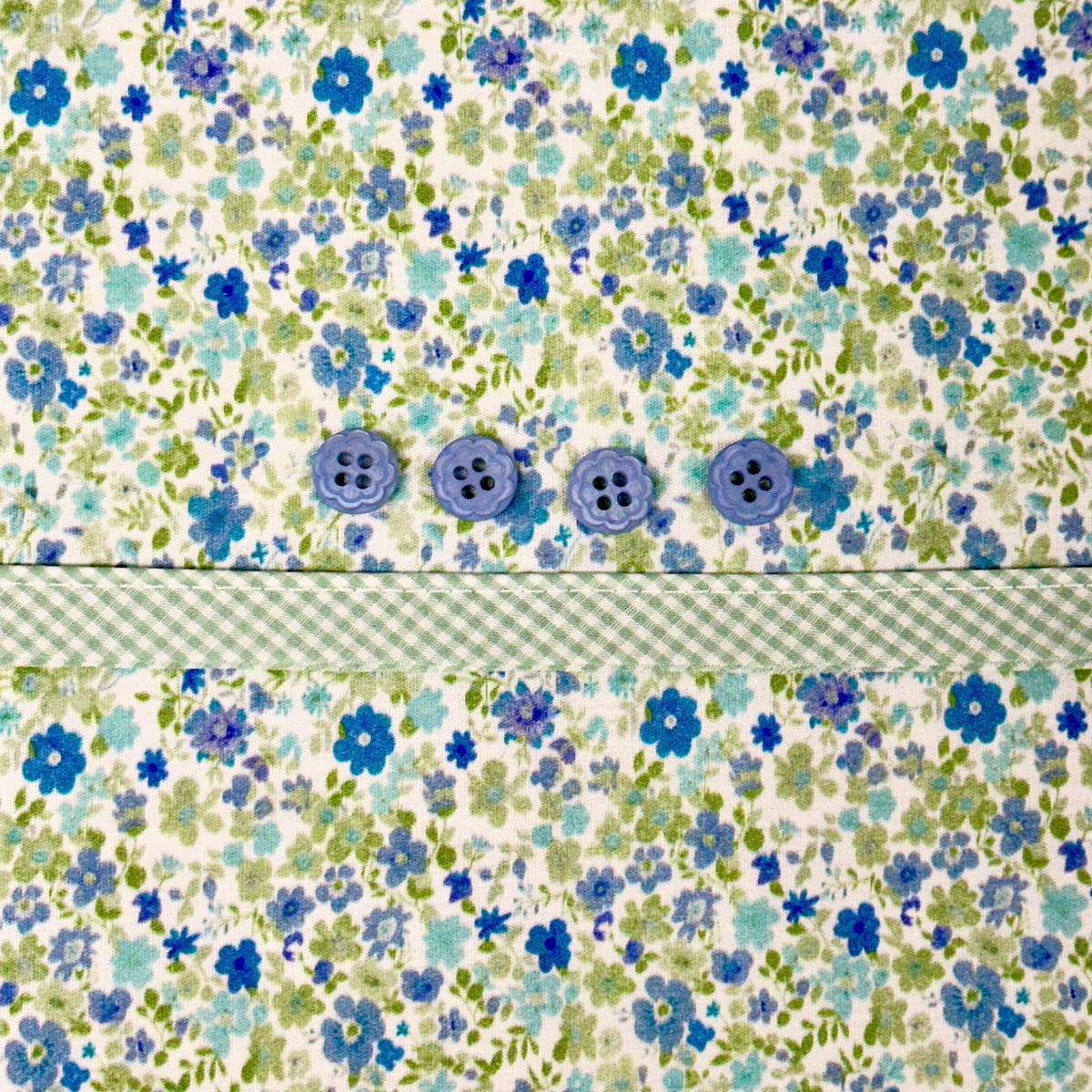 Blue floral fabric kit with gingham trim and three decorative blue buttons
