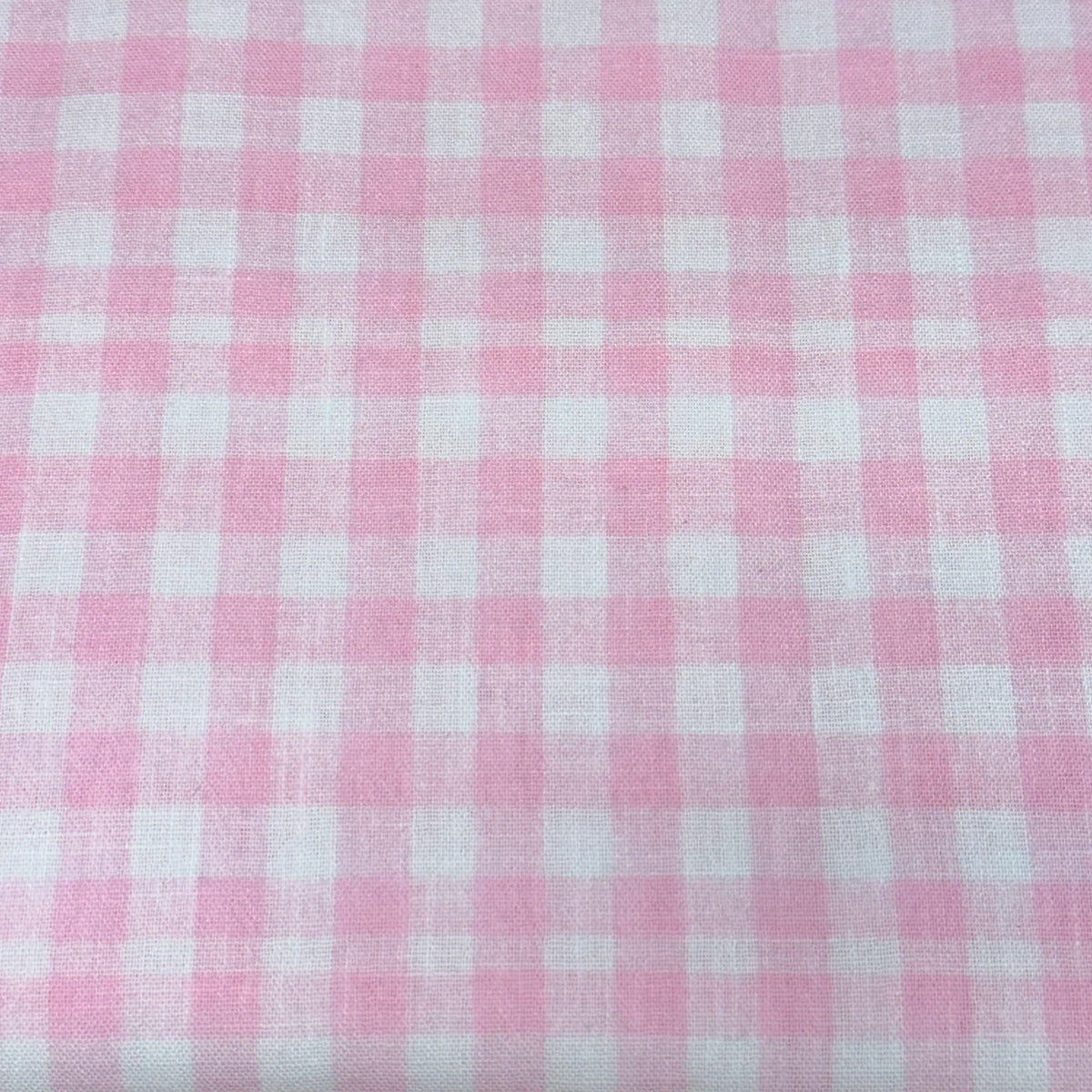 Pink and white small gingham check woven poly fabric by Riley Blake
