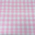 Pink and white small gingham check woven poly fabric by Riley Blake