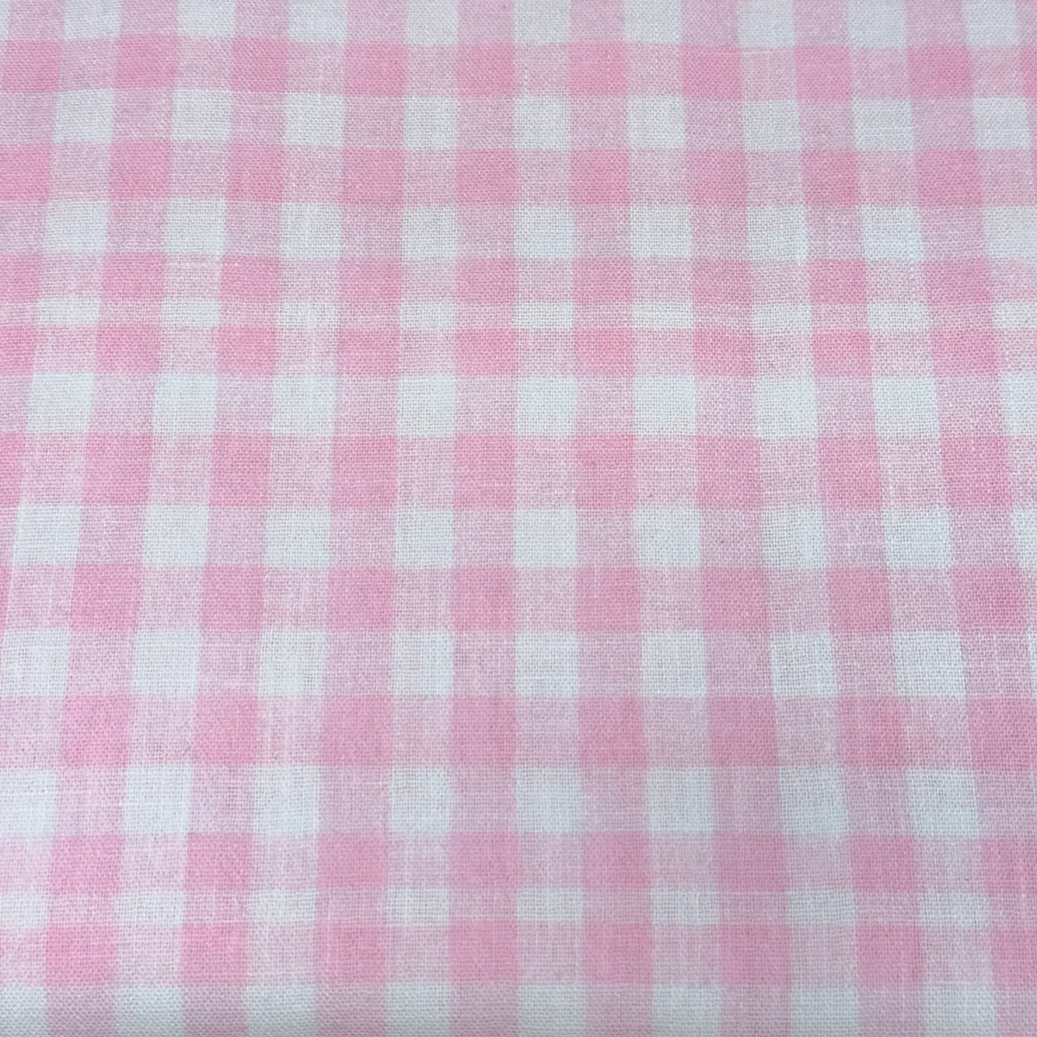 Pink and white small gingham check woven poly fabric by Riley Blake