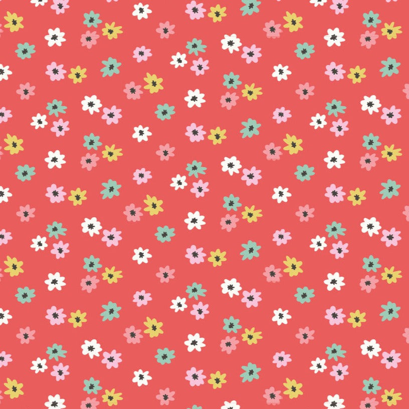 Red fabric with scattered small multicolor daisy flowers in pink, white, teal, and yellow