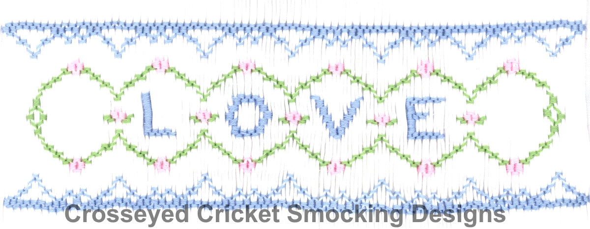 Smocking plate sample showing LOVE in blue letters with green circles and pink accents