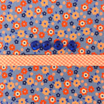 Blue floral fabric with orange flowers, four blue buttons, and pink gingham ribbon trim.