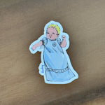 Vintage-style baby sticker in blue gown with blonde hair, signed Lindsey