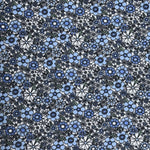 Cornflower Fields fabric with dense blue floral print on white cotton by Fabric Finders