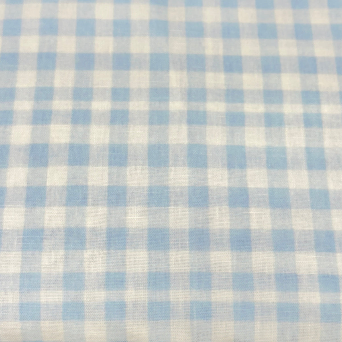 Light blue and white gingham check woven poly fabric, small uniform squares
