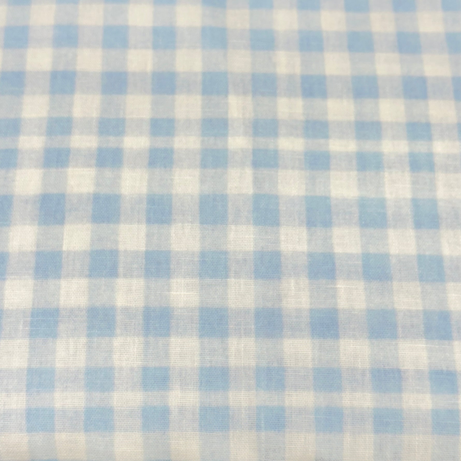 Light blue and white gingham check woven poly fabric, small uniform squares