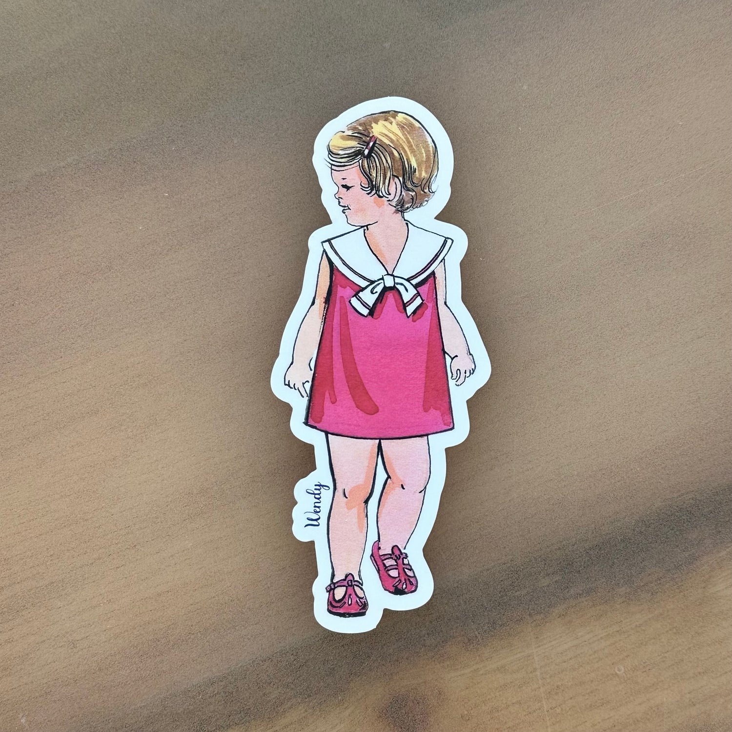 Wendy watercolor sticker of a girl in pink sailor dress and red shoes