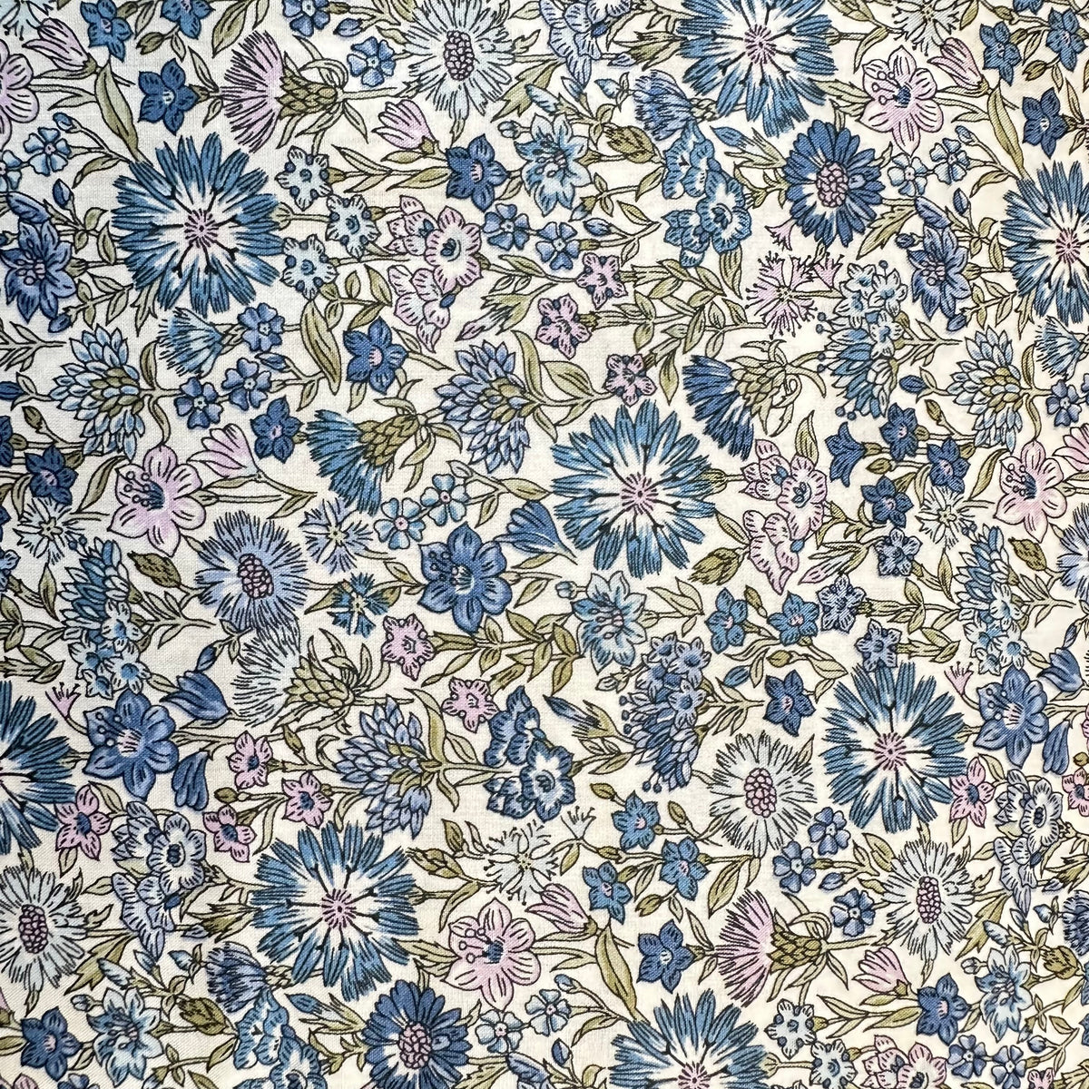 Liberty Tana Lawn fabric with blue and pink floral print on ivory background