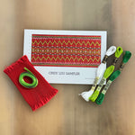 Cindy Lou smocking sampler kit with red pleated fabric, green ribbon, and DMC floss