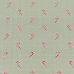Sage green fabric with scattered red and white candy cane print pattern