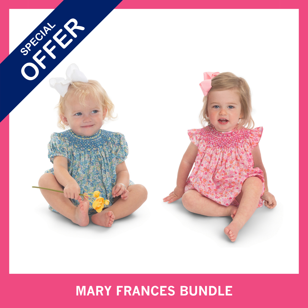Two toddler girls in smocked floral dresses, blue and pink, Mary Frances Bundle