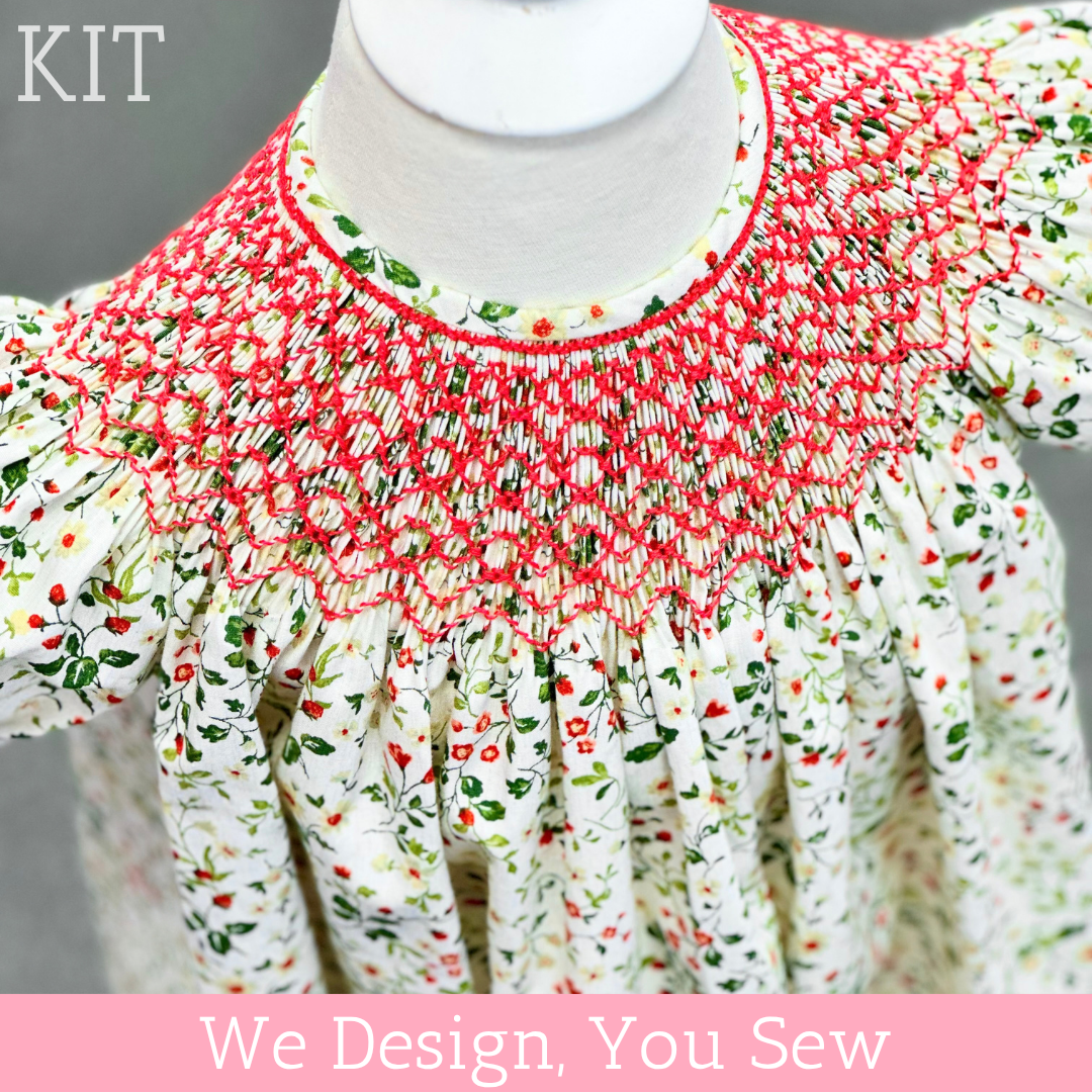 White floral smocked bishop dress kit with red embroidery on dress form