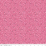 Pink cotton fabric with scattered small red and burgundy floral ditsy print pattern