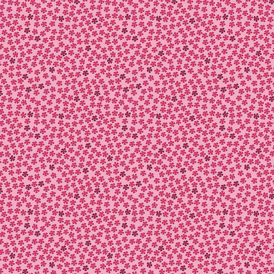 Light pink cotton fabric with scattered small red and burgundy floral mini roses pattern