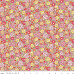 Traditional 1930s style floral fabric pattern in pink yellow orange red with ruler measurement