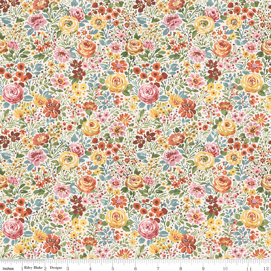 Cream quilting fabric with dense multicolor floral print in pink, yellow, and orange tones.