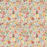 Cream fabric with dense multicolor floral print in pink, yellow, orange, and green