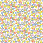 White fabric with dense multicolor daisy floral print in yellow, orange, pink, and blue
