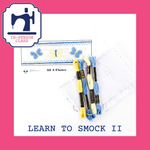 Learn to Smock II kit with blue and yellow embroidery floss and smocked butterfly pattern plate
