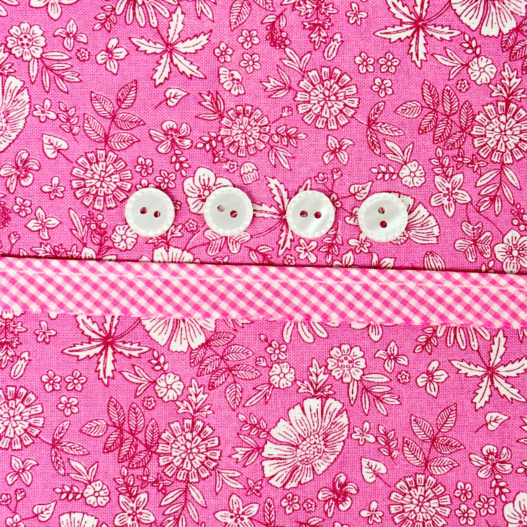 Pink floral fabric with gingham trim and four white buttons, Carol Dress Kit