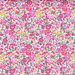 Liberty of London Emma and Georgina fabric with dense pink, magenta, and yellow floral print on white