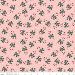 Pink flannel fabric with red and white candy canes and green bows pattern