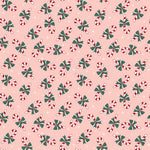 Pink flannel fabric with tossed red and white candy canes and green bows pattern