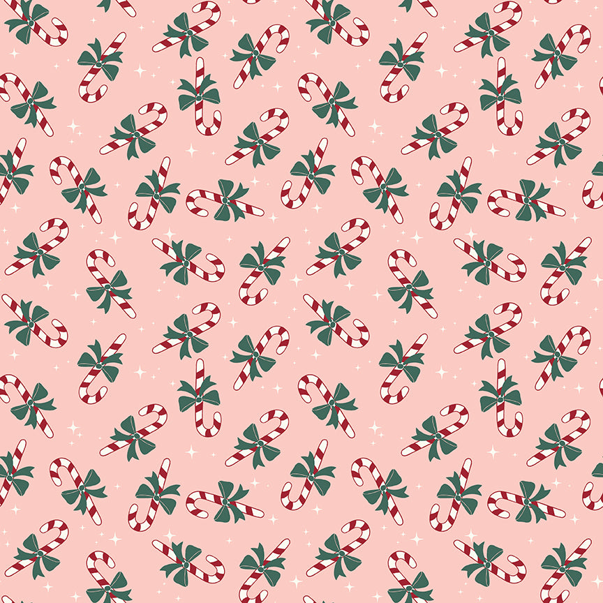 Pink flannel fabric with tossed red and white candy canes and green bows pattern