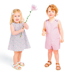 Two toddlers modeling handmade Lucy dress and Johnny romper sewing patterns