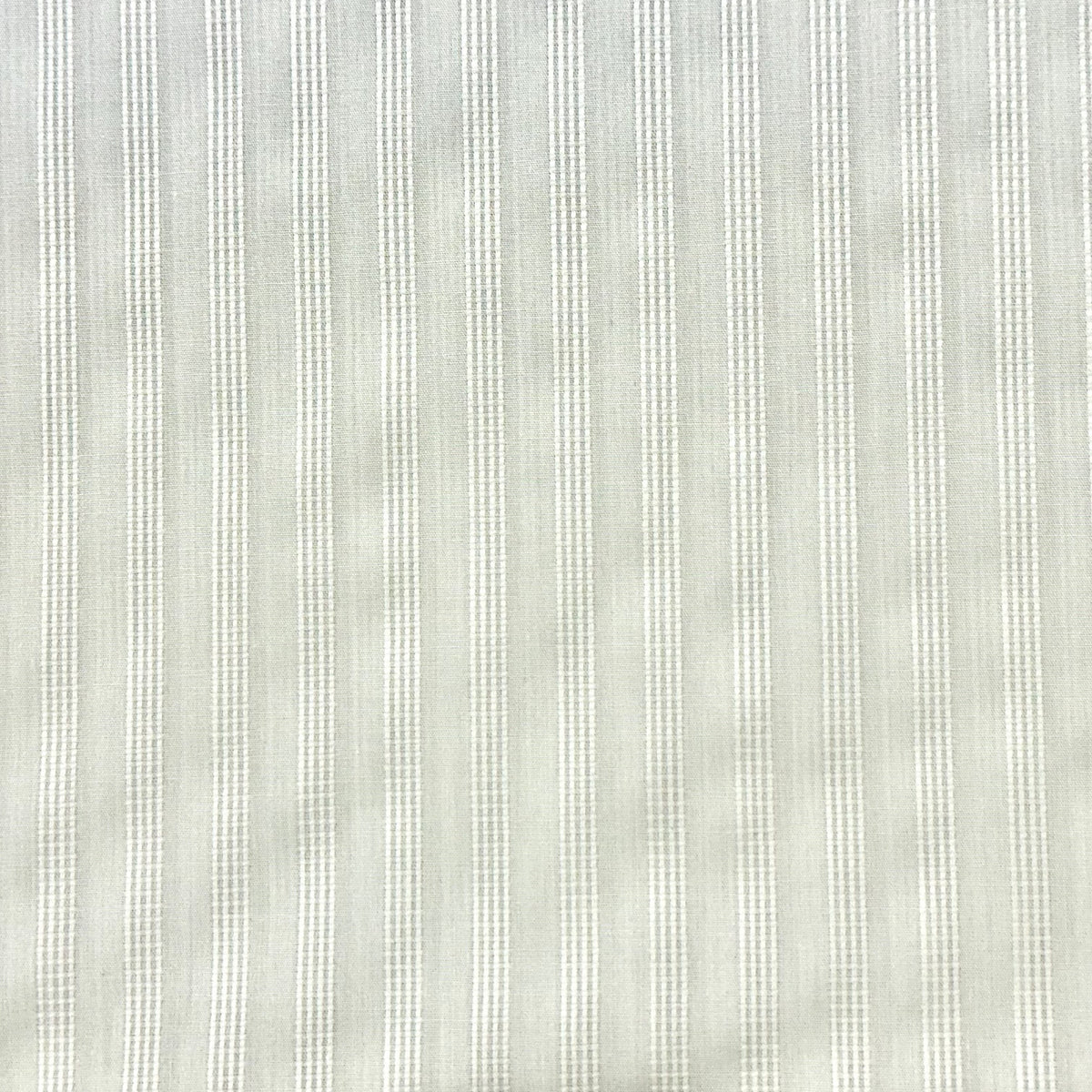 Light sage green fabric with vertical white pinstripes in a classic ticking stripe pattern