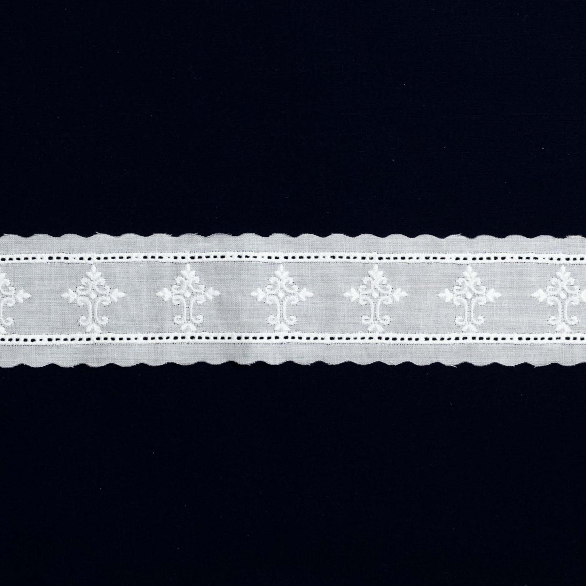White Swiss embroidered lace trim with cross motifs and scalloped edges
