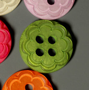 Scalloped flower plastic buttons in green, pink, orange, and red with four holes