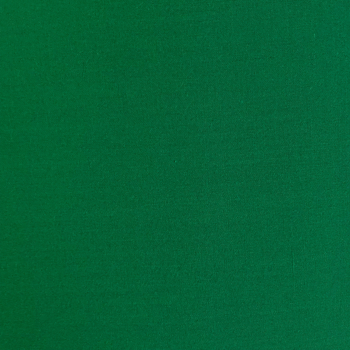 Solid kelly green woven batiste fabric with smooth, fine texture