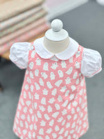 Pink baby dress with white ghost print and white Peter Pan collar on mannequin